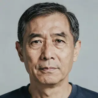 A portrait of a middle-aged man with a calm, serious express
