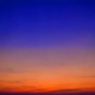 A sunset sky gradient on a flat surface from #FF6B35 (orange