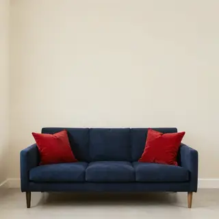 A minimalist room with walls in #F5E6CC (warm cream), a sofa