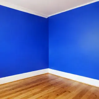 A room with walls in #4A90D9 (medium blue) with warm wooden 