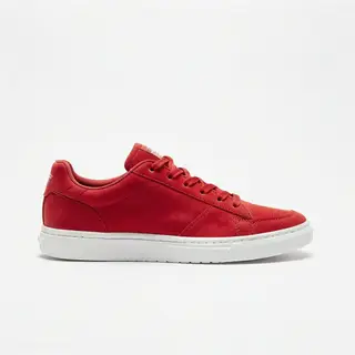 A single red sneaker on a clean white background with soft s