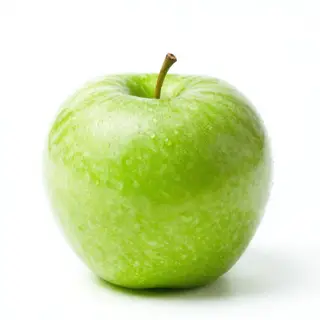 A ripe green apple on a seamless white background with soft 
