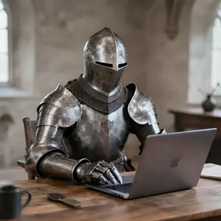 A medieval knight in full armor sitting at a desk typing on 