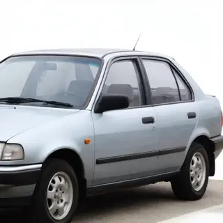 A car body with windows, doors, and headlights but no wheels