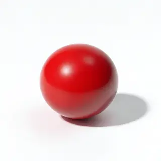 A red sphere on a white surface with a single shadow cast to