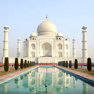 The Taj Mahal in Agra seen from the reflecting pool, with ac