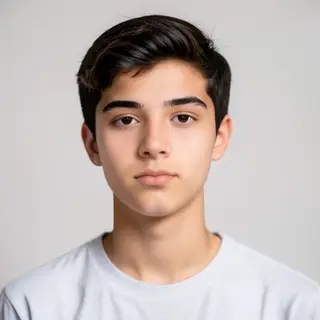 A headshot of a teenager with a relaxed, neutral face
