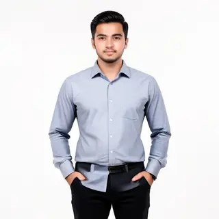 A man standing straight facing the camera, hands in pockets,