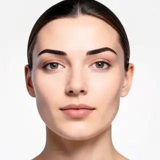 A human face with eyes, nose, and mouth but no eyebrows