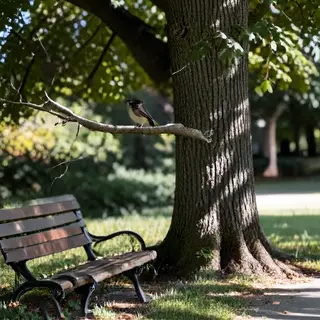 A bird perched on a branch, the branch extending from a tree