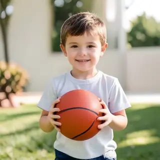 A child holding a basketball, both at correct relative sizes