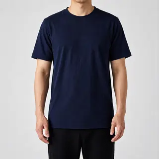 A person standing with both hands visible at their sides, fi
