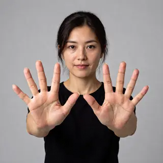 A woman holding her hands out in front of her palms-up, all 