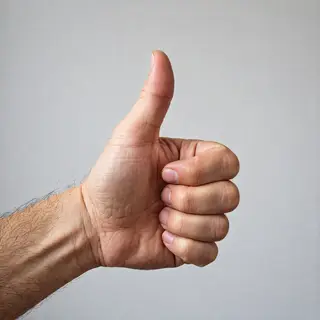 A hand giving a thumbs-up with four fingers curled and thumb