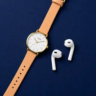 A product flat-lay on a #1A1A2E (deep dark blue) background,