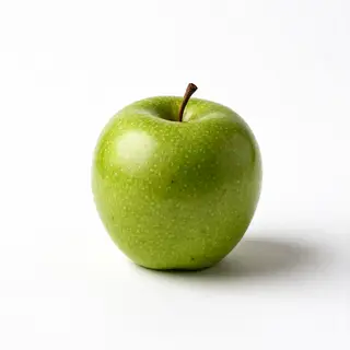 A ripe green apple on a seamless white background with soft 
