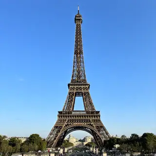 The Eiffel Tower in Paris on a clear day, architecturally ac