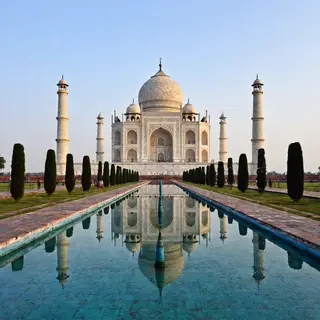 The Taj Mahal in Agra seen from the reflecting pool, with ac