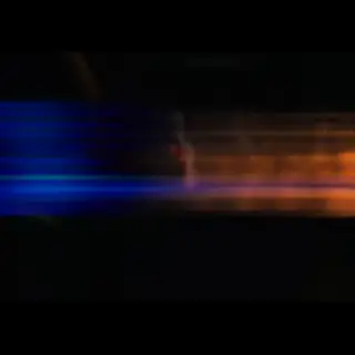 A cinematic frame with blue and orange anamorphic lens flare