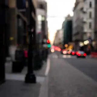 A street photograph with shallow depth of field as if shot a