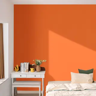 A bedroom wall painted in #FF6B35 (burnt orange) with white 