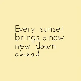'Every sunset brings a new dawn ahead' written neatly on a p