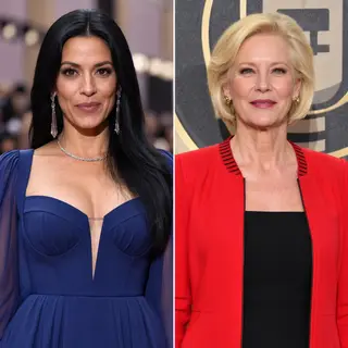 Two women standing side by side: one with short blonde hair 