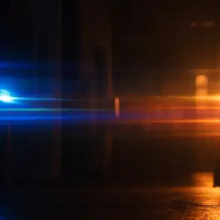 A cinematic frame with blue and orange anamorphic lens flare