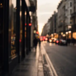 A street photograph with shallow depth of field as if shot a