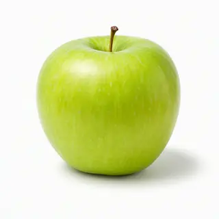 A ripe green apple on a seamless white background with soft 