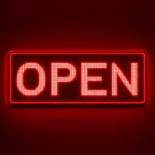 The word 'OPEN' displayed on a red LED sign with glowing pix