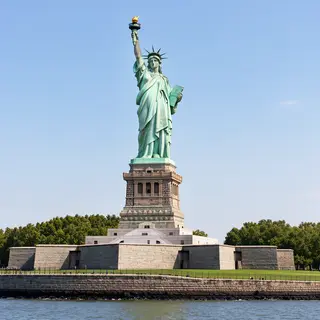 The Statue of Liberty on her island pedestal, with correct t