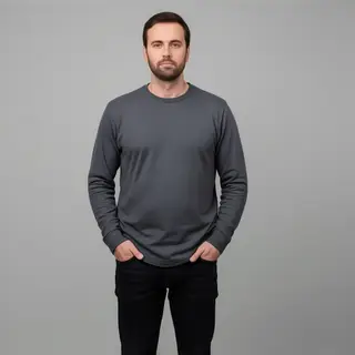 A man standing straight facing the camera, hands in pockets,