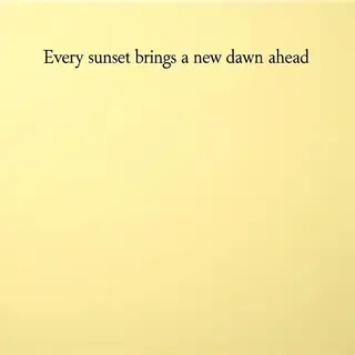 'Every sunset brings a new dawn ahead' written neatly on a p
