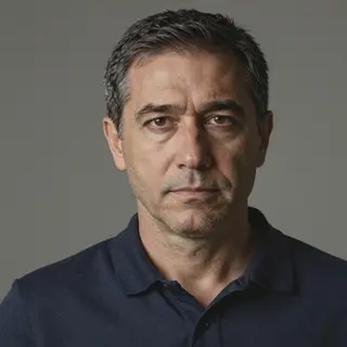 A portrait of a middle-aged man with a calm, serious express