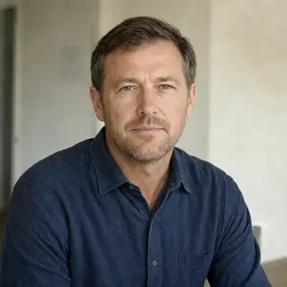 A portrait of a middle-aged man with a calm, serious express