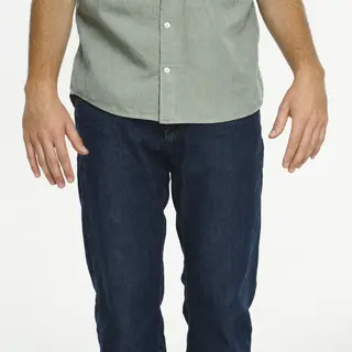 A person standing with both hands visible at their sides, fi