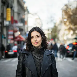 A street photograph with shallow depth of field as if shot a