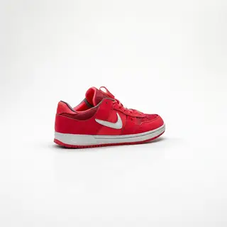 A single red sneaker on a clean white background with soft s