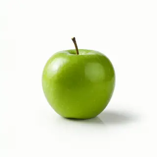 A ripe green apple on a seamless white background with soft 