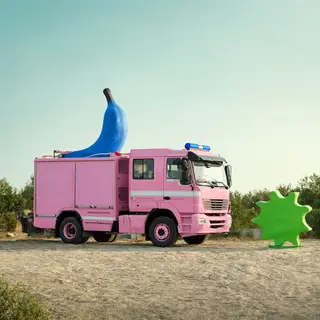 A pink fire truck, a blue banana, and a green sun in a surre