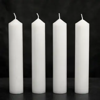 Exactly 4 white candles standing on a dark surface