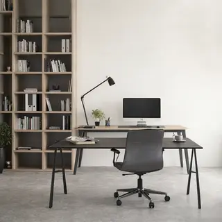 An office workspace with a desk, chair, bookshelf, and lamp 