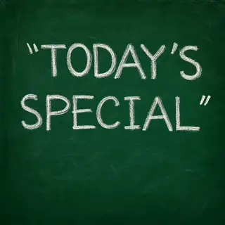 The phrase 'TODAY'S SPECIAL' written in white chalk on a dar