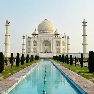 The Taj Mahal in Agra seen from the reflecting pool, with ac