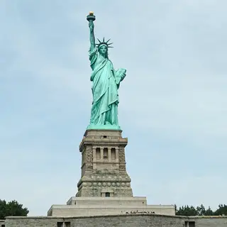 The Statue of Liberty on her island pedestal, with correct t