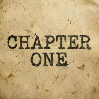 The word 'CHAPTER ONE' typed on aged paper with a vintage ty
