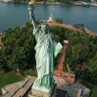 The Statue of Liberty on her island pedestal, with correct t