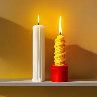 A tall thin white candle, a short fat red candle, and a medi