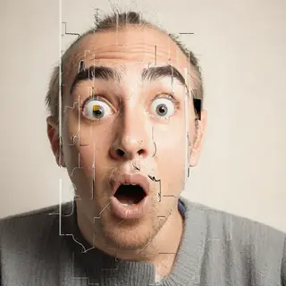 A portrait capturing genuine surprise — raised eyebrows, wid
